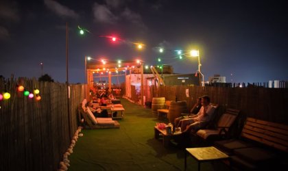 It’s party time at night on the rooftop of Abraham Hostel in Jerusalem